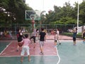 Shenzhen, China: weekend, office workers are playing basketball fitness