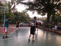 Shenzhen, China: weekend, office workers are playing basketball fitness