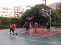 Shenzhen, China: weekend, office workers are playing basketball fitness