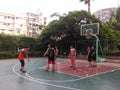 Shenzhen, China: weekend, office workers are playing basketball fitness