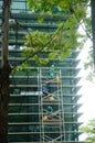 Shenzhen, China: workers clean glass curtain wall in high-rise building Royalty Free Stock Photo