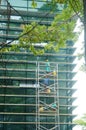 Shenzhen, China: workers clean glass curtain wall in high-rise building Royalty Free Stock Photo