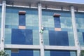 Shenzhen, China: workers clean the glass curtain wall in high-rise building