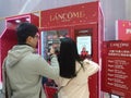 Shenzhen, China: young men and women are getting free cosmetics samples.