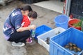Shenzhen, China: a young mother with her daughter in the aquarium