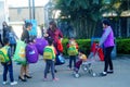 Shenzhen, China: a young mother takes her child home from kindergarten