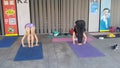 Shenzhen, China: young women practice yoga