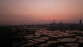 Shenzhen skyline , with skyscrapers and office against fish farm or fish ponds, during dramatic moment in evening Royalty Free Stock Photo