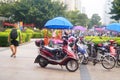 Shenzhen street landscape, tourists and bicycle parking