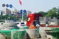 Shenzhen, China: street construction, truck loading and unloading construction materials