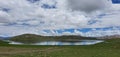 The thick clouds are reflected in the mesmerising and mysterious Sheosar Lake. Royalty Free Stock Photo