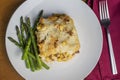 shepards pie served with sauteed asparagus