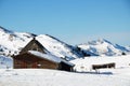 Shepherd's house on the snow slope in mountains