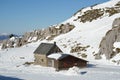 Shepherd's house on the snow slope in mountains