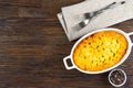 Shepherd's Pie or Cottage Pie, traditional British dish on brown wooden backgfound Royalty Free Stock Photo