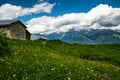 Shepherds cottage on a green meadow in Caucaus Mountains, Svaneti, Georgia.