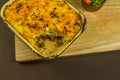 Shepherds or cottage pie in serving dish, one portion taken Royalty Free Stock Photo