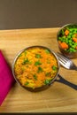 Shepherds or cottage pie in serving dish with parsley, portrait Royalty Free Stock Photo