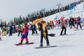 Sheregesh, Kemerovo region, Russia - April 03, 2021: Grelka Fest in Sheregesh. People in carnival costumes on the snow slope Royalty Free Stock Photo