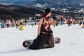 Sheregesh, Kemerovo region, Russia - April 03, 2021: Grelka Fest in Sheregesh. People in carnival costumes on the snow slope Royalty Free Stock Photo