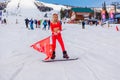 Sheregesh, Kemerovo region, Russia - April 12, 2019: Young happy pretty woman dressed in carnival costume of a red devil riding on