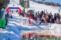 Sheregesh, Kemerovo region, Russia - April 13, 2019: Pool and ride contest where people on a swimming ring playing huge bowling on