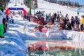 Sheregesh, Kemerovo region, Russia - April 13, 2019: Pool and ride contest where people on a swimming ring playing huge bowling on