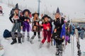 Sheregesh, Kemerovo region, Russia - April 06, 2019: Young women in carnival costumes of witches on the mountain slope.