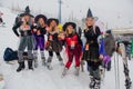 Sheregesh, Kemerovo region, Russia - April 06, 2019: Young women in carnival costumes of witches on the mountain slope