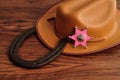 A sheriff badge with a brown cowboy hat and a horse shoe Royalty Free Stock Photo