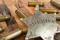 Sheriff badge and bullets shell