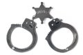 Sheriff Badge and Handcuffs - Stock Photo Royalty Free Stock Photo