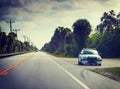 Sheriff car in Florida Everglades parked on the edge of the road on a cloudy day Royalty Free Stock Photo