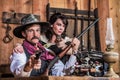 Sheriff Points Gun With Woman Royalty Free Stock Photo