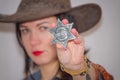 The grey Sheriff`s star in the background of girls cowboy Royalty Free Stock Photo