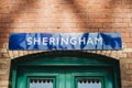 Sheringham station sign at a station in Sheringham, Norfolk, UK