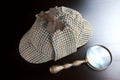 Sherlock Deerstalker Hat, And Vintage Magnifying Glass On Bla