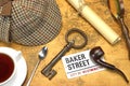 Sherlock Holmes Deerstalker Cap And Other Objects On Old Map Royalty Free Stock Photo