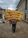 Sherpa porter carrying a heavy load in Nepal