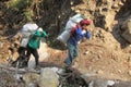 Sherpa porter carry basket in Nepal trekking path