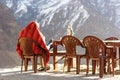 Sherpa warming up in the sunrise at the Annapurna Base Camp, Nepal