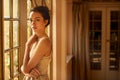 Shes absolutely stunning. Portrait of a beautiful young woman standing in an elegant room.