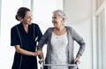 Shes all the care you need. a female nurse assisting a senior woman using a walker. Royalty Free Stock Photo