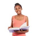 Shes an avid reader. Studio portrait of a young african american girl reading a book isolated on white.