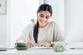 Shes always been highly organised. a young businesswoman writing notes in an an office. Royalty Free Stock Photo