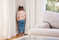 Shes been sent to timeout. a little girl standing in the corner as a punishment at home. Royalty Free Stock Photo