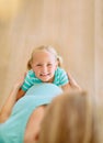 Shes the big sister the baby will look up to. Portrait of a little girl hugging her mothers pregnant belly at home. Royalty Free Stock Photo