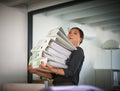 Shes bitten off more than she can chew. Portrait of a hardworking businesswoman struggling to carry a heap of files in Royalty Free Stock Photo