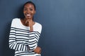 Shes brimming with confidence. Portrait of a confident, attractive young woman on a gray background.