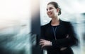 Shes the calm within the business storm. a young businesswoman standing with her arms crossed in an office doorway. Royalty Free Stock Photo